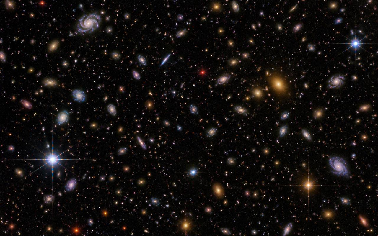 Ett litet utsnitt av Rubin-observatoriets första djupfältsbilder. Varje ljuspunkt utan diffraktionspiggar är en galax – bilden visar bara en bråkdel av det synfält teleskopet fångar i en enda exponering.